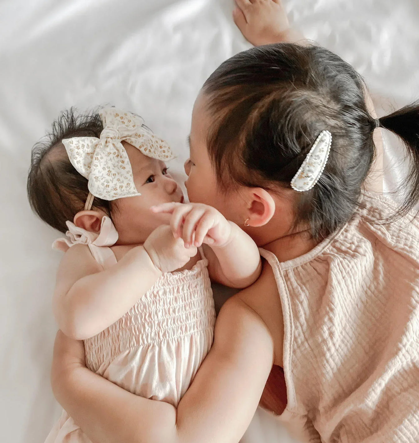 Infant and toddler wearing Mai and I hair accessories