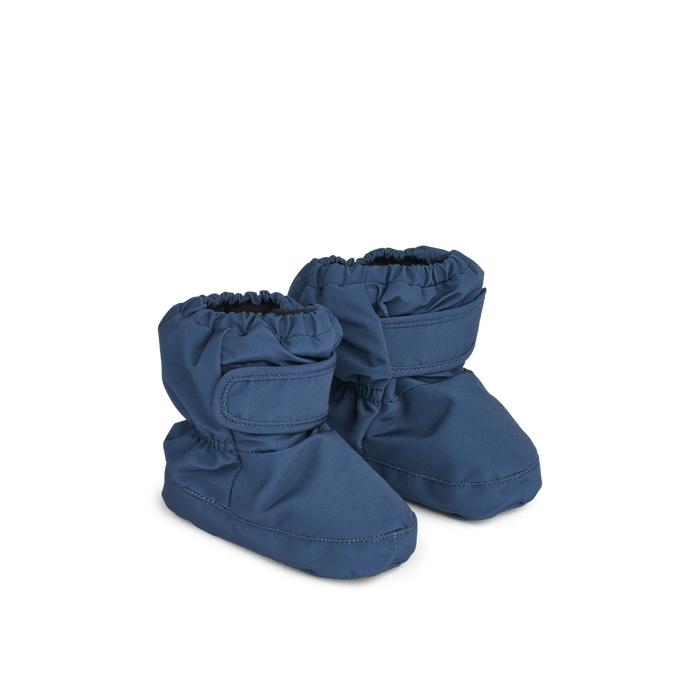 Cozy and stylish baby footies designed to keep little feet warm and secure in 
indigo blue color